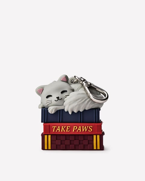Porte-flacon PocketBac Chat sur une pile de livres